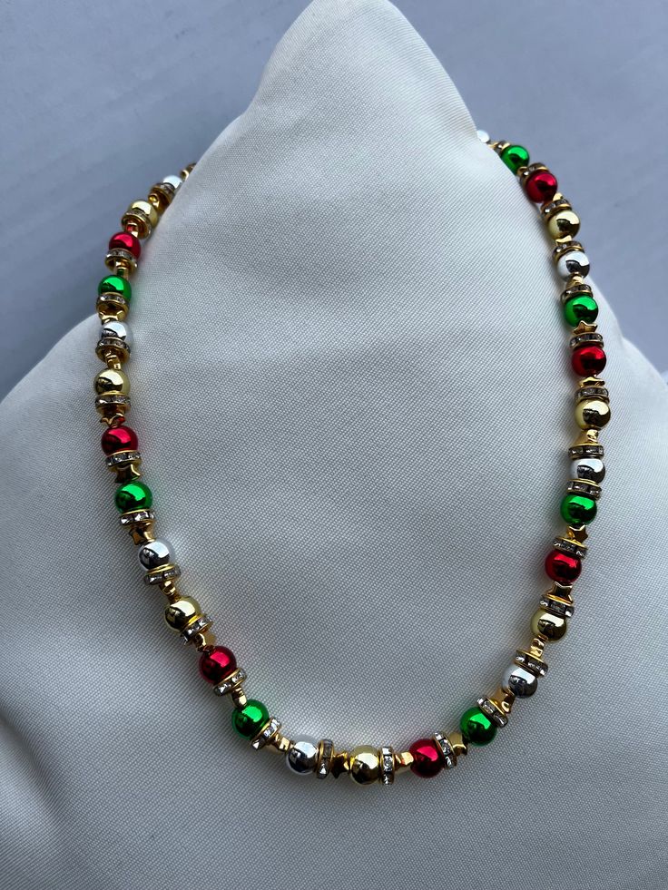 christmas themed multicoloured necklace with gold beads  can be made with silver or other required colours too  lenghth of necklace 15 inches ]has an adjustable chain to it Holiday Festive Jewelry With Colorful Beads, Festive Holiday Jewelry With Colorful Beads, Multicolor Round Beads Christmas Jewelry, Adjustable Multicolor Christmas Jewelry, Multicolor Round Beads Jewelry For Holidays, Adjustable Festive Necklace With Round Beads, Colorful Beaded Jewelry For Holiday Gifts, Festive Adjustable Round Bead Necklace, Holiday Jewelry Gift With Colorful Beads