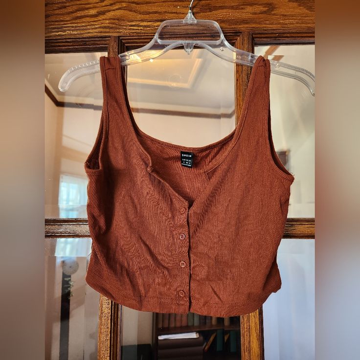 Shein Burnt Orange Crop Tank Top Size M. New Without Tags But Has Been Washed. Armpit To Armpit 15" Shoulder To Bottom 15" *All Measurements Done Laying Flat On Table. I Do Have A Dog And I Do My Best To Keep Hair Off Clothing. Bundle 5 Items And I Will Send You An Offer For $20. Only Items With Qualify For Deal. Deal Doesn't Qualify For Shipping Discounts Clothing Bundle, Orange Crop Top, Crop Tank Top, Shein Tops, Cropped Tank Top, Crop Tank, Burnt Orange, Color Orange, A Dog