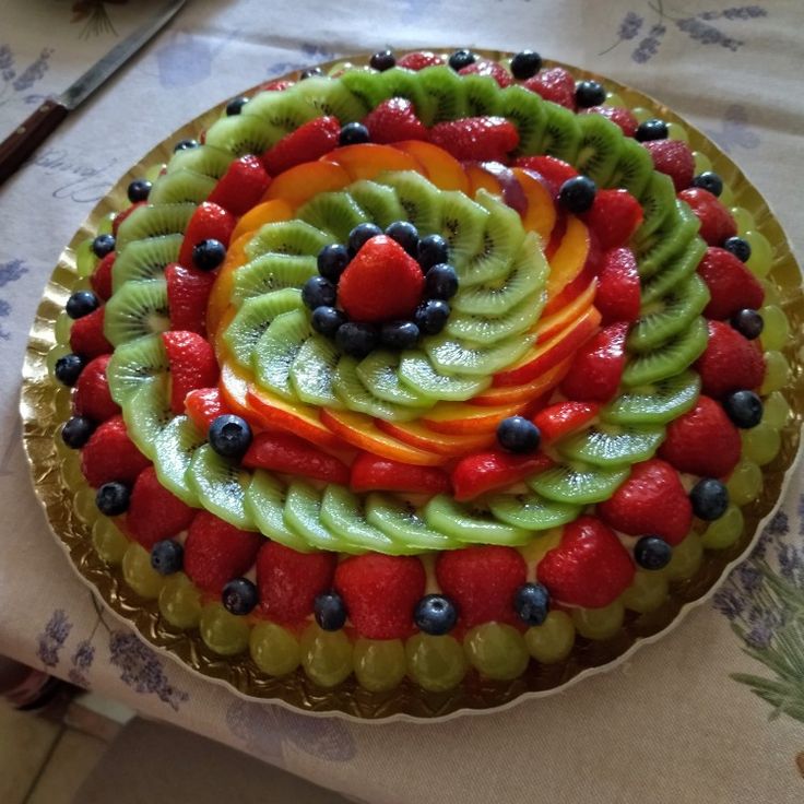 there is a cake that has fruit on it