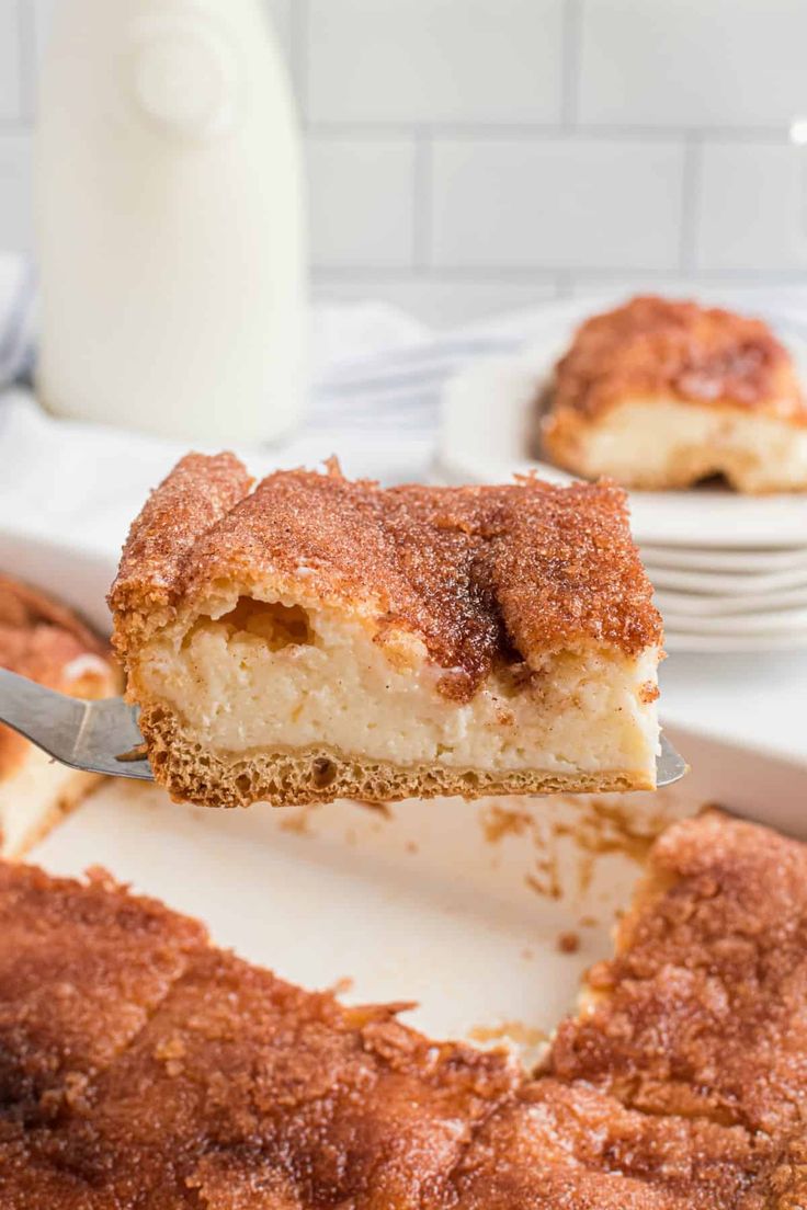 a piece of cake being lifted from a pan