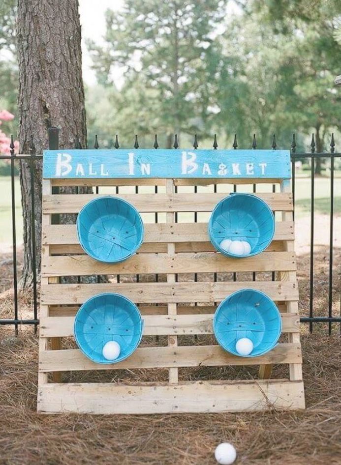 a wooden pallet with bowls and balls on it