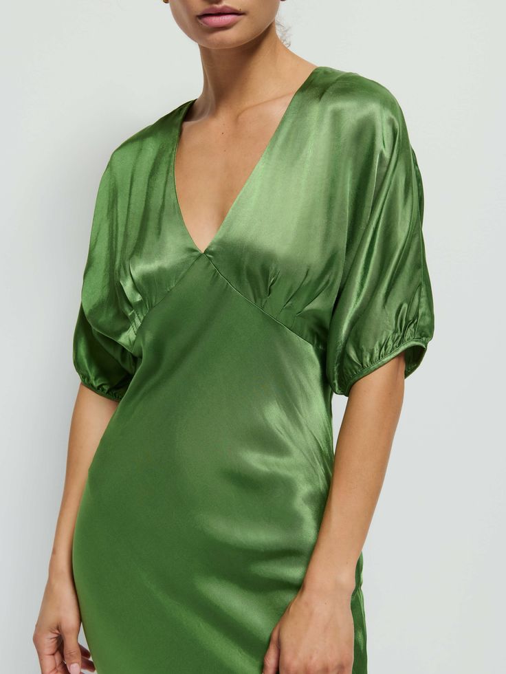 This is that event dress you'll actually wear all the time. V-neckline, bust darts, balloon sleeves, and an invisible back zipper. Cue the compliments. (This one comes in Salon Green.) | Lily-Rose Dress in Salon Green | Ethical Essentials Silk V-neck Dress With Gathered Sleeves, Fitted Silk V-neck Dress For Date Night, Fitted V-neck Puff Sleeve Dress For Wedding, Evening Dresses With Balloon Sleeves And Fitted Bodice, Voluminous Evening Dresses With Elastic Sleeves, Green Balloon Sleeve Party Dress, V-neck Midi Dress With Gathered Sleeves For Night Out, Fitted V-neck Dress With Gathered Sleeves For Party, Green Midi Dress With Gathered Sleeves For Party