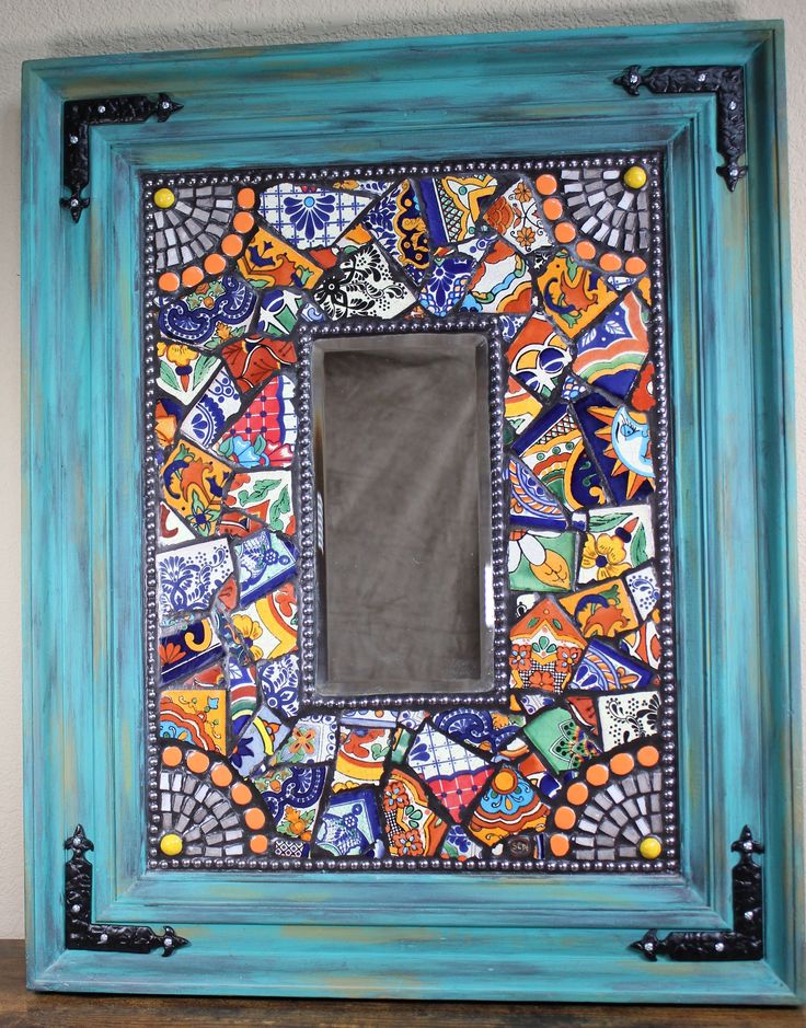 a blue frame with colorful tiles on the front and sides, painted in different colors