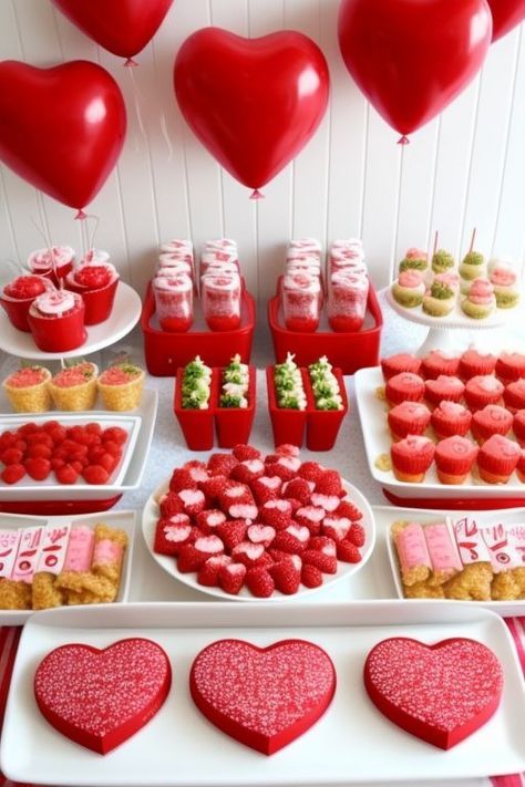 valentine's day dessert table with heart shaped cookies and cupcakes