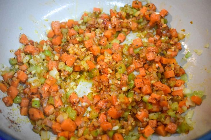 chopped carrots and celery in a white bowl