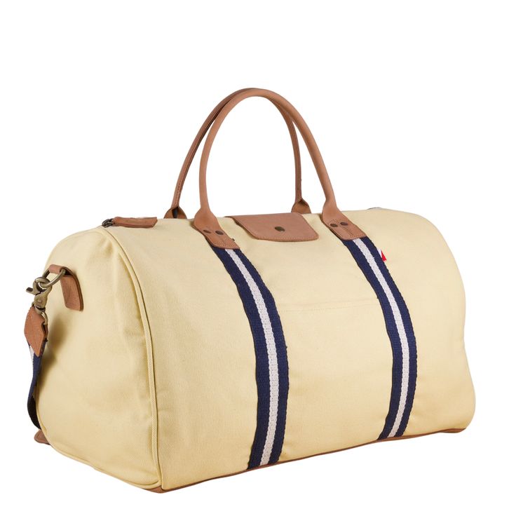 This duffle is a perfect size to bring as a carry-one or in addition to your other bags. There's a handy trolly slip on the back so it slips easily over your rollie-bag handles. With a full leather bottom and details, this bag will add some style back to your travels! Matching travel kits also available. (The Natural bag has black /natural striped webbing). This item can also be monogrammed!Product Overview: Dimensions: 18" x 10" x 10" with a 6" handle drop, 55" adjustable / detachable strap Hea Beaded Bag, Travel Kits, Pocket Mirror, Bag Handle, Easy Access, Real Leather, Cotton Canvas, Shoulder Strap, Slip On