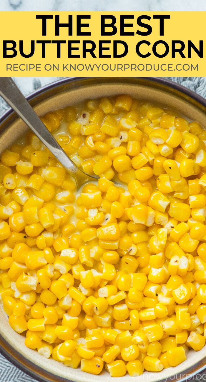 a bowl filled with corn on top of a blue and white towel next to a spoon