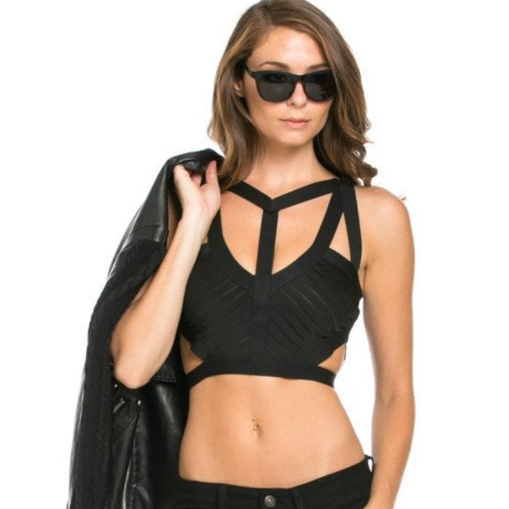 Skinny Straps Intersect To Create A Trendy Caged Look Across The Cupped And Bust Of This Sexy Ponte Knit Crop Top. Cropped Style Is Sexy And Chic. Zip-Back Fastening Lightweight Fabric With Sheer Mesh Insert Hand Wash 100% Polyester Imported Strappy Crop Top With Crisscross Straps For Night Out, Strappy Halter Top For Club, Trendy Strappy Halter Top For Party, Chic Strappy Crop Top For Night Out, Trendy Strappy Halter Top For Night Out, Stretch Hollow Out Crop Top For Night Out, Stretch Crop Top With Hollow Out For Night Out, Black Triangle Crop Top For Night Out, Spring Strappy Halter Top For Night Out