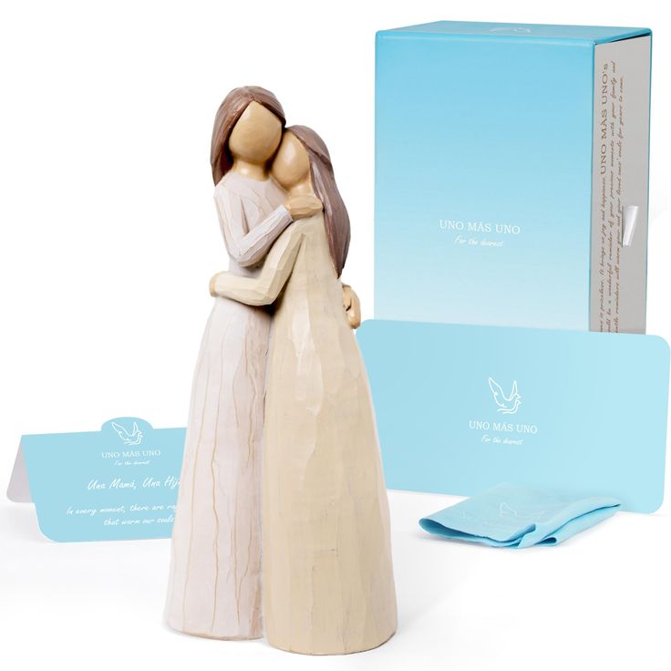 a ceramic figurine is next to a boxed box and greeting card for someone special