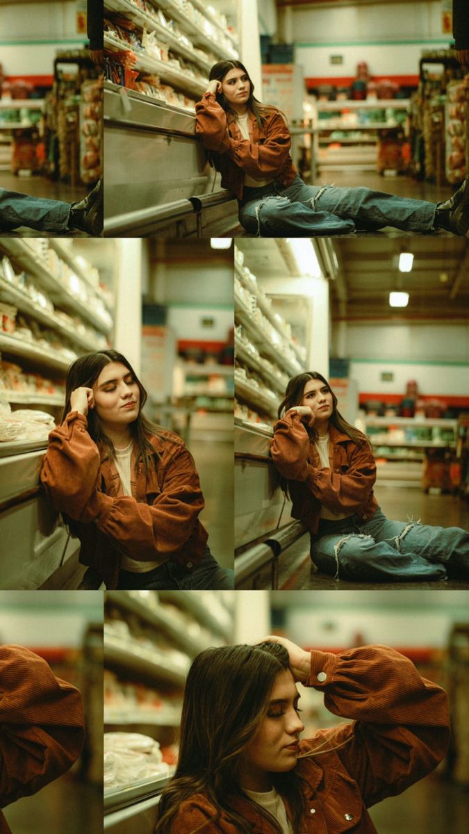 a woman sitting on top of a shelf in a store