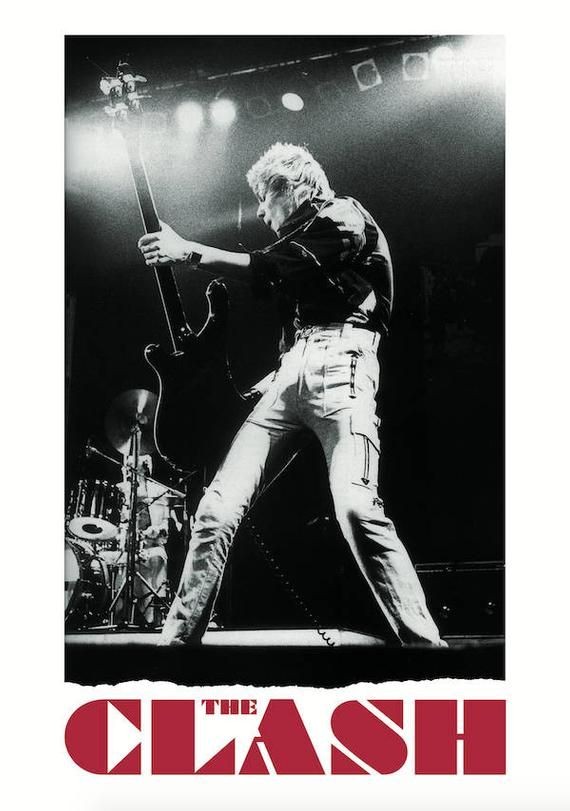 the clash concert poster is shown with an image of a man on stage holding a guitar