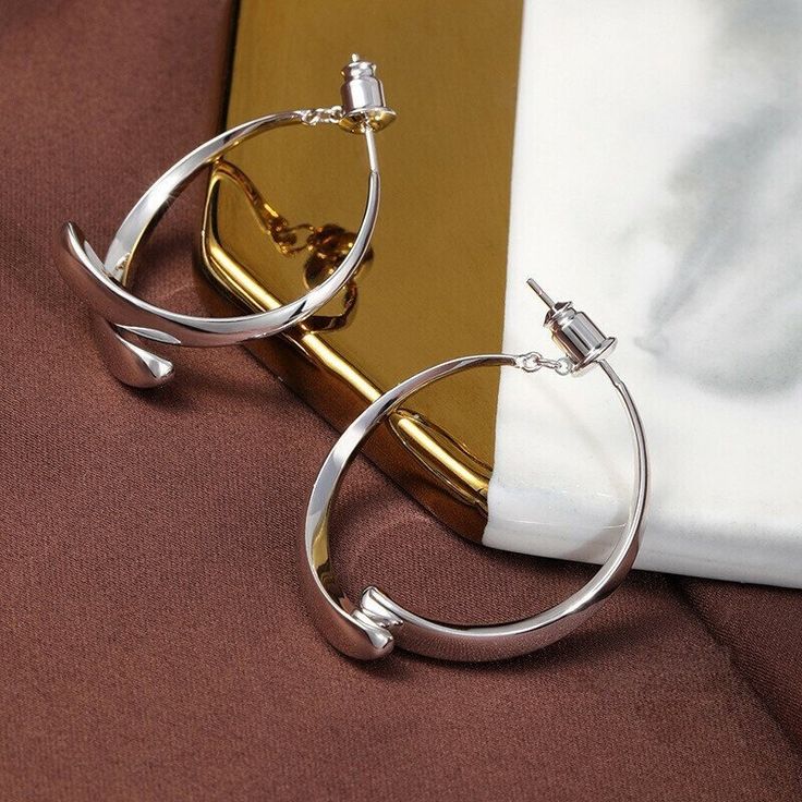 The classic circle shape, with its careful mechanism, two semicircles outline a ring, hanging between the ears at different angles will present different shapes, each angle has its beauty, concise and capable without losing the modern sense of collocation. Lookfashionable and elegantwith these gorgeous Simple Curved Earrings!! Features Small and lightweight- Wear or carry it around with you for a variety of earring options wherever you go. Wide application- Suitable for both everyday use and special occasions like parties, clubbing, weddings, and more. Perfect gift idea- Great gift to give for all ladies like mothers, grandmothers, aunts, cousins, girlfriends, and more. Excellent material-S925 ear acupuncture material, comfortable to wear, not easy to allergies. Thick electroplating is not Semi-circle Metal Hoop Earrings, Elegant Circle Metal Earrings, Elegant Circular Metal Earrings, Formal Circular Metal Earrings, Modern Circular Earrings For Party, Elegant Open Circle Metal Jewelry, Modern Hoop Earrings With Simple Design, Elegant Open Circle Hoop Earrings Gift, Elegant Semi-circle Metal Earrings