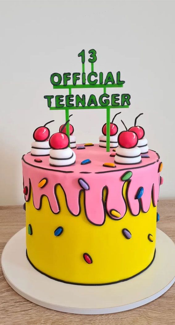 a yellow and pink birthday cake with two cherries on top that says 13th official teenager