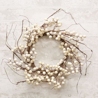 The Snowberry Twig Wreath is a decorative floral wreath with a natural, brown-wrapped base. The wreath is filled with long, spindly twigs and features branches of ivory snowberries, creating a soft, wintry feel. Display this wreath hanging on a wall or door, bringing a simple and charming touch to the home during Winter and Christmas. Measures 6.5” in diameter (inner) and approximately 16-18" in diameter (outer). Primrue | Primrue White Snowberry & Twig Wreath 18.0 H x 18.0 W x 5.0 D in brown / Shabby Chic Hearts, Wreath Hanging, Winter And Christmas, Twig Wreath, White Wreath, Rag Wreath, Berry Wreath, Rustic Art, Everyday Wreath