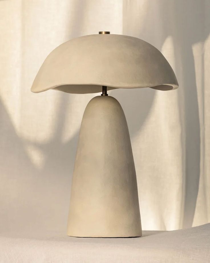 a table lamp sitting on top of a white surface