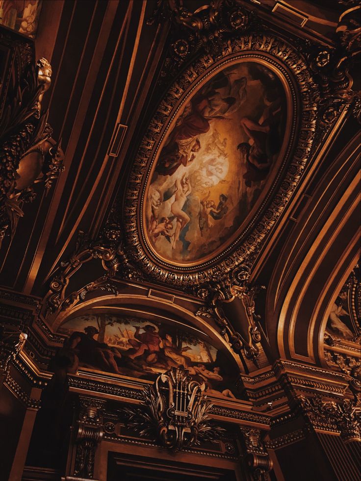 an ornately decorated ceiling with paintings on it