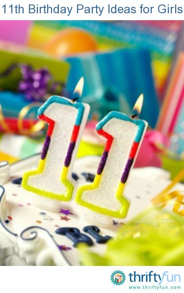 two birthday candles with the number one on them in front of other party supplies and gifts