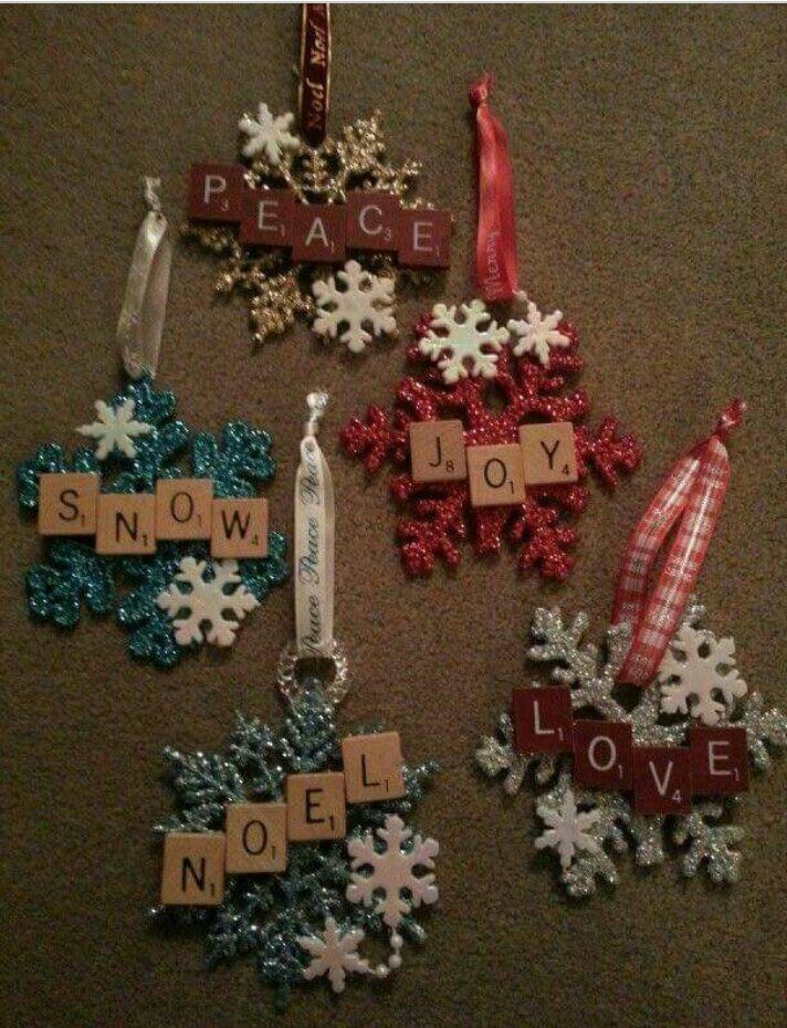 christmas ornaments made from scrabbles on the floor with words that spell out peace and joy