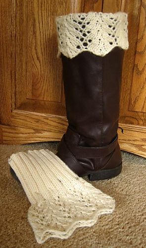 a pair of brown boots and a white crochet boot cover on the floor