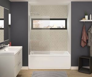 a bathroom with gray walls and white fixtures