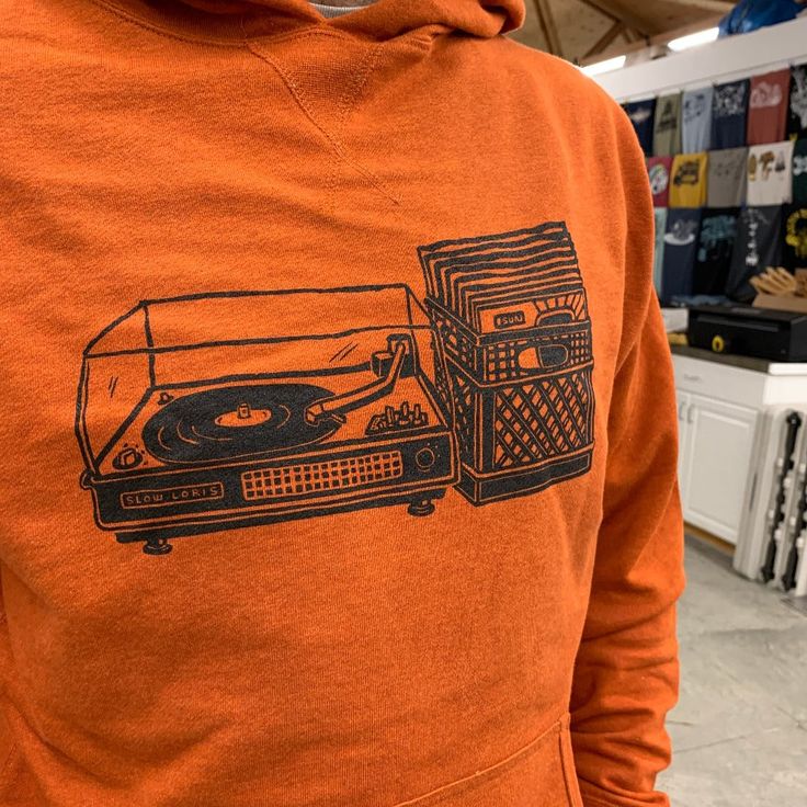 Browse the stacks in style and comfort. Screen printed in Black ink on Autumn Orange French Terry cotton/poly* pullover hoodie. Thumb hole cuffs! The hem of this hoodie hits just below the waist, so we recommend sizing up if you have a long torso or like a longer fit. Unisex size XS-XXL available. Specs and size chart in photos. *70%/30% Retro Cotton Hoodie With Drawstring Hood, Casual Hooded Hoodie With Screen Print, Retro Cotton Hoodie With Graphic Print, Casual Hooded Sweatshirt With Screen Print, Retro Relaxed Fit Hoodie For Fall, Retro Cotton Hoodie With Ribbed Cuffs, Fall Hooded Sweatshirt With Screen Print, Casual Winter Hoodie With Screen Print, Hip Hop Hoodie With Screen Print For Fall