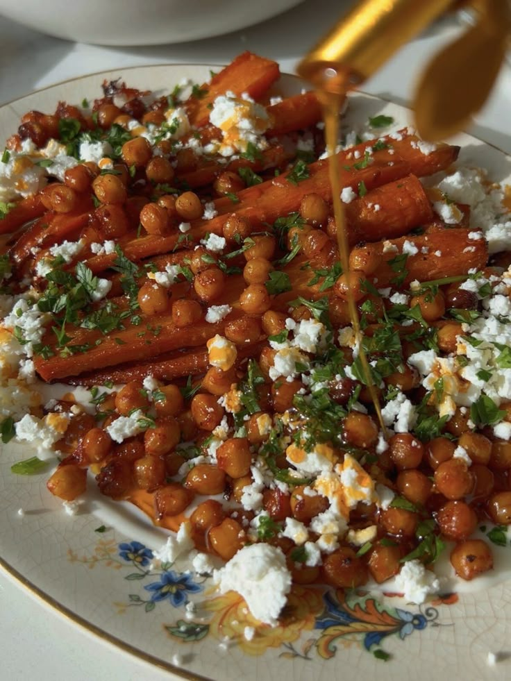 carrots and chickpeas with feta cheese on a plate