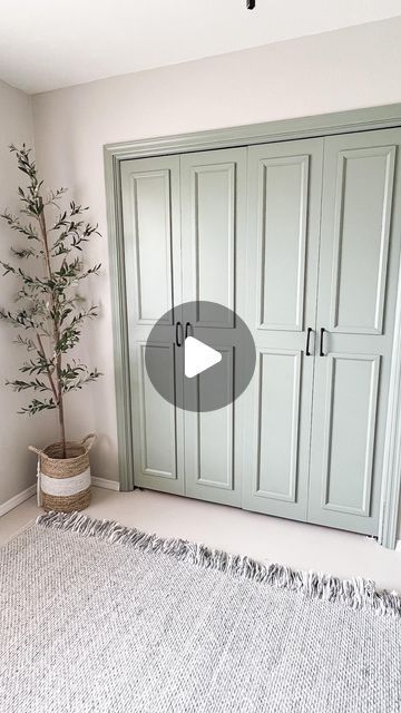 an empty room with green cabinets and a white rug in front of the closets