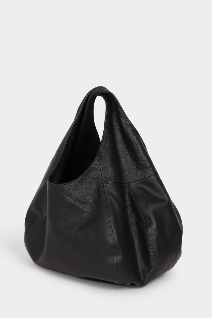 Roomy, squashy hobo bag with a twisted top handle in soft Nappa Leather. 100% Nappa Leather Lined Two interior pockets Length: 14” Width: 18” Shoulder Strap Length: 14” Strap Drop: 6" Interior Pocket: 4" x 4.75” Made in Peru Brand Chocolate, Corporate Girl, Sweatshirt Women Casual, Twisted Top, Studio Bag, Leather Hobo Bag, Boho Bag, Memento Mori, Small Handbags