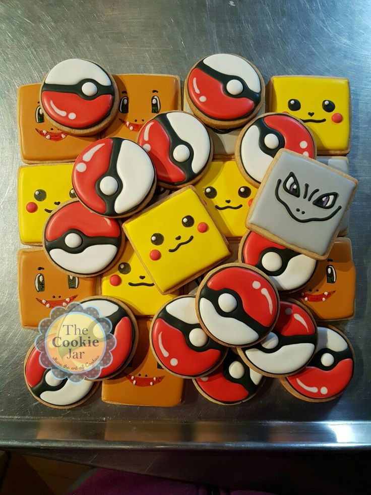 some cookies with different designs on them are arranged in the shape of pokemons and pikachu's