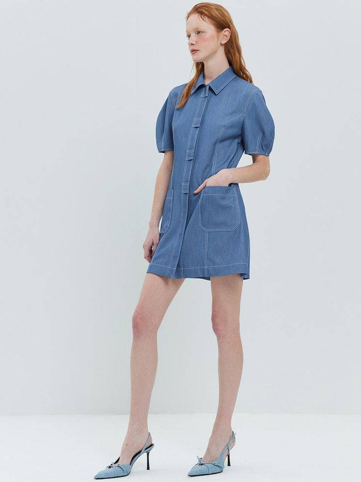 This soft shirt dress with the perfect pop of pretty.A smooth fabric with comfort stretch and a soft texture.It's easy to wear, comfortable and looks good with just about everything. - Standard collar and button down dress- Ready for those special occasions a tailored look is needed or mix it up with your favorite everyday pieces- Meet our crisp and light weight shirt dress- Puff sleeves and stitch details - Soft and lightweight with polyester blend Button Down Denim Dress, Button Down Dress, Soft Texture, Puff Sleeves, Denim Dress, Blue Dresses, Puff Sleeve, Button Downs, Special Occasion