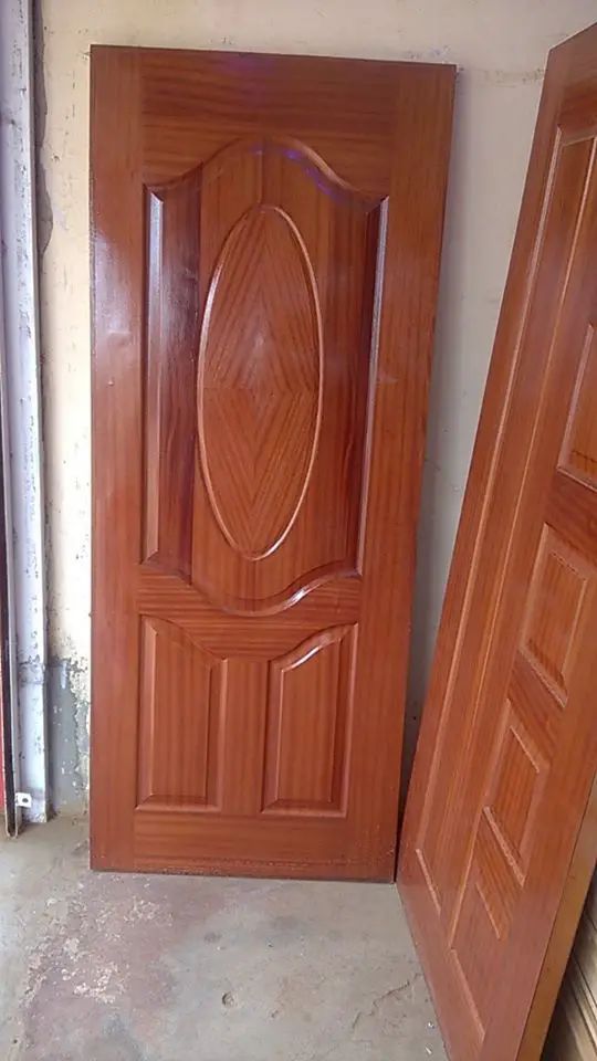 two wooden doors are next to each other