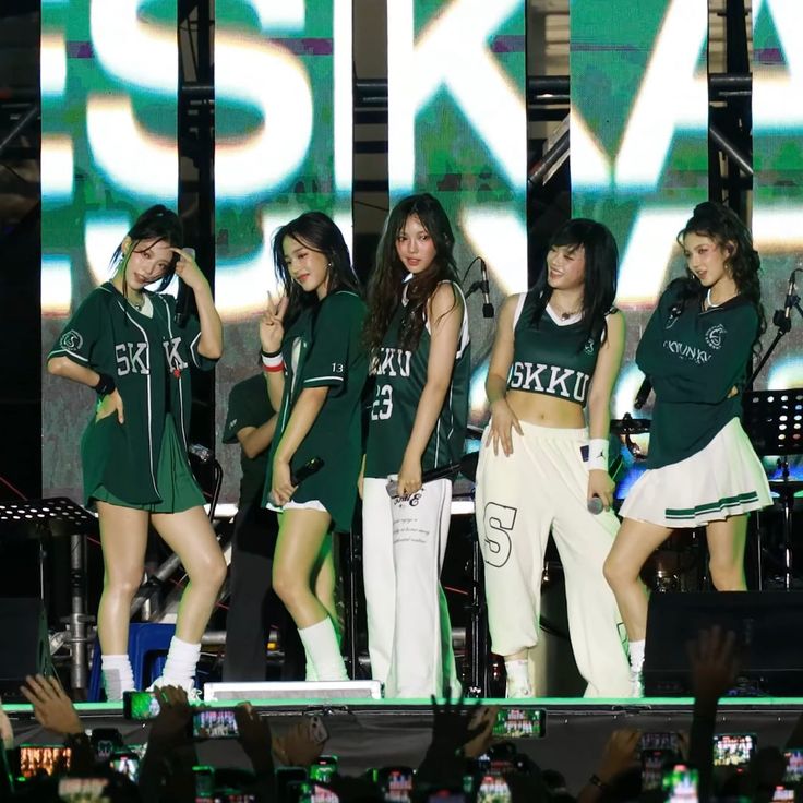 girls'generation performing on stage at an event