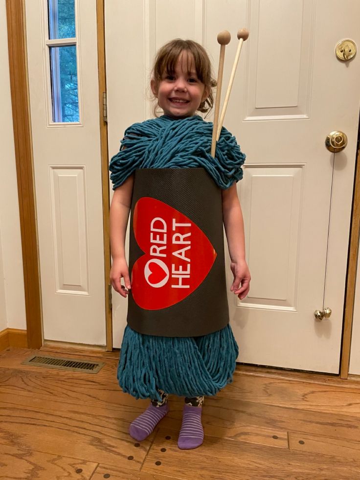 My daughter asked to be a skein of yarn for Halloween. 
Made with:
Yoga Mat from 5 Below
3 skeins of thick blue yarn
1 wooden dowel cut in half
2 large craft beads 
Permanent Vinyl Skein Of Yarn Costume, Yarn Halloween Costume, Ball Of Yarn Costume, Yarn Costume, Yarn Halloween, Hottest Halloween Costumes, Food Halloween Costumes, Handmade Halloween Costumes, Pregnant Halloween Costumes