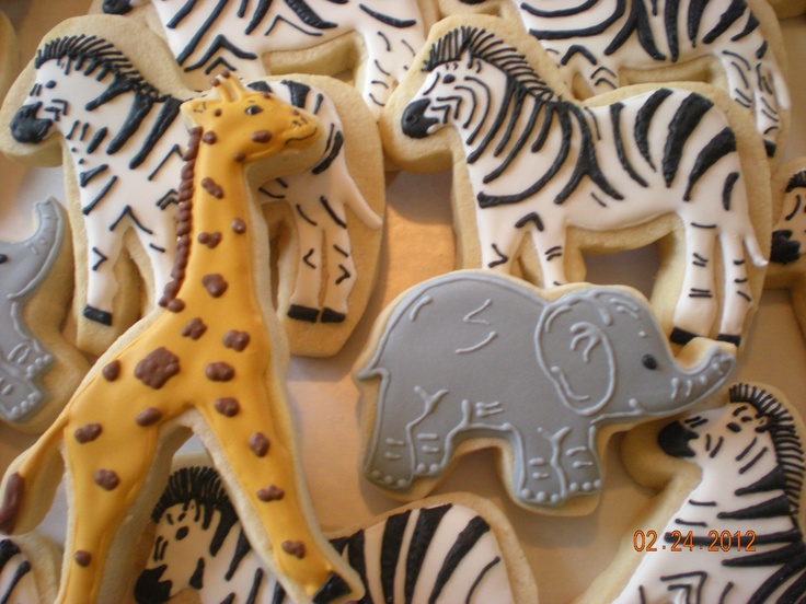 decorated cookies in the shape of animals and zebras