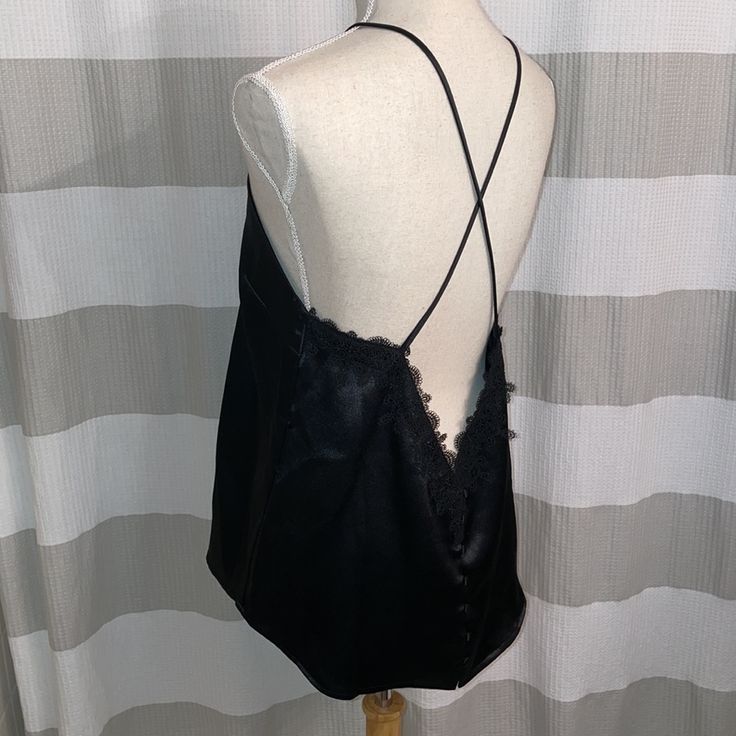 Urban Outfitters Black Satin Tank Top With Deep Back Cut And Lace Detailing And Buttons On Back. Never Worn! Chic Black Camisole, Chic Black Tank Top For Day Out, Urban Outfitters Sleeveless Tank Top For Party, Chic Black Tank Top For Going Out, Chic Black Tank Top For Night Out, Chic Black Camisole For Date Night, Elegant Black Tank Top For Day Out, Chic Urban Outfitters Tops For Night Out, Satin Tank Top