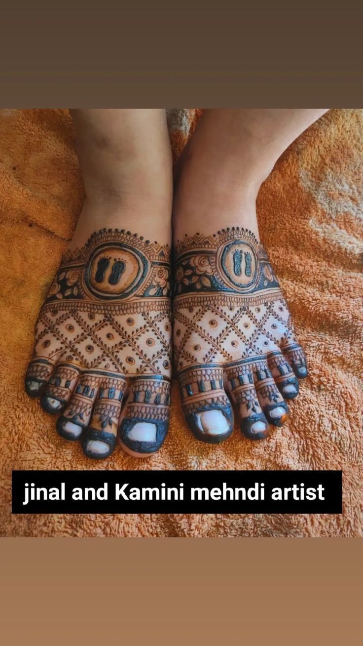 the feet and hands of a woman with hendi