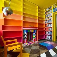 colorful bookshelves and chairs in a brightly colored room