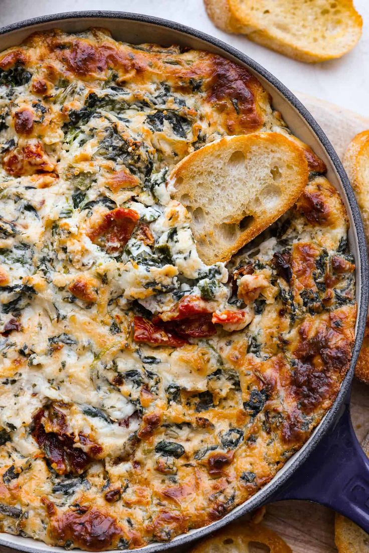 a casserole with spinach, cheese and bread