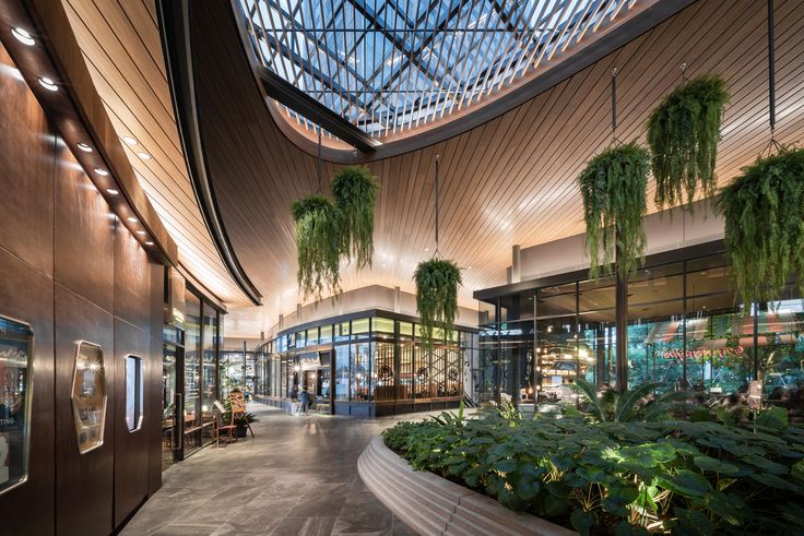 the inside of a building with plants growing in it