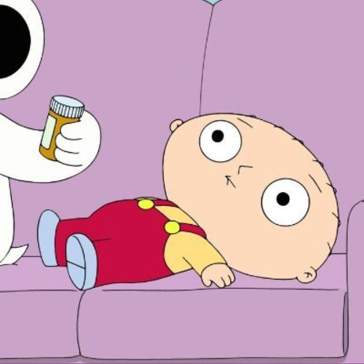 a man laying on top of a couch next to a cartoon character holding a bottle