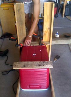 a man working on a piece of furniture