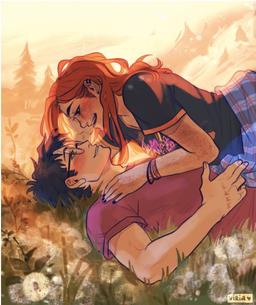 an image of a woman kissing a man on the cheek with flowers in the background