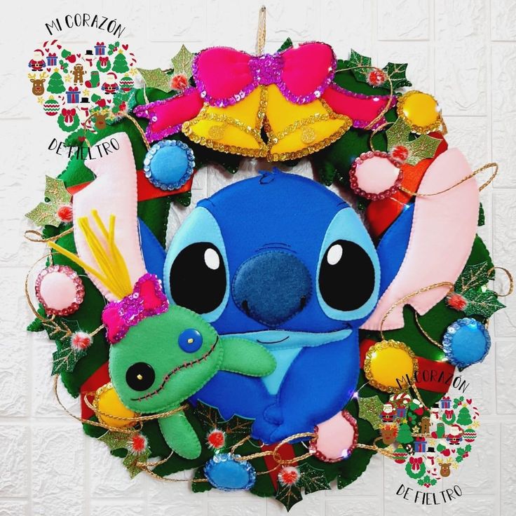 a christmas wreath with stitching on the front and side of it, featuring an adorable cartoon character