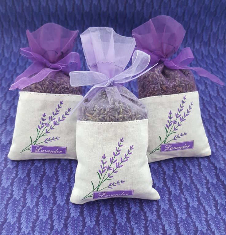 three bags filled with lavender tea sitting on top of a purple blanket