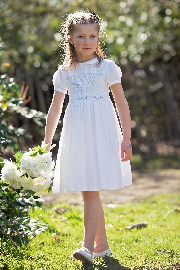 Back by popular demand: Blanche is the perfect Holy Communion, Christening and flower girl dress with its delicate smocking and all white flower embroidery.

Delicate puffed cap sleeves create a romantic silhouette, while intricate hand smocking and embroidery makes this dress perfect for those very special occasions. White Flower Embroidery, Hand Smocking, Romantic Silhouette, Smocked Baby Dresses, Girls White Dress, Best Bow, Hand Smock, Baby Dresses, Embroidered Clothes