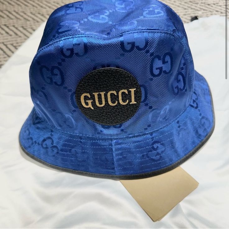 Nwt Authentic Blue Gucci Bucket Hat. Comes With Dust Bag And Authentication Certificate. Trendy Gucci Hat With Short Brim, Gucci Short Brim Summer Hats, Designer Gucci Hats With Short Brim, Elegant Gucci Short Brim Hat, Designer Gucci Hat With Short Brim, Gucci Elegant Short Brim Hat, Elegant Gucci Adjustable Hat, Luxury Adjustable Gucci Hat, Gucci Designer Wide Brim Hat