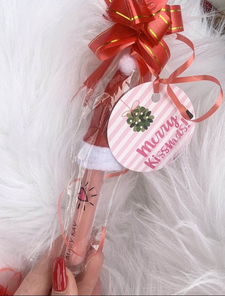 a pink pen with a red bow on it and a tag that says mountain kreme