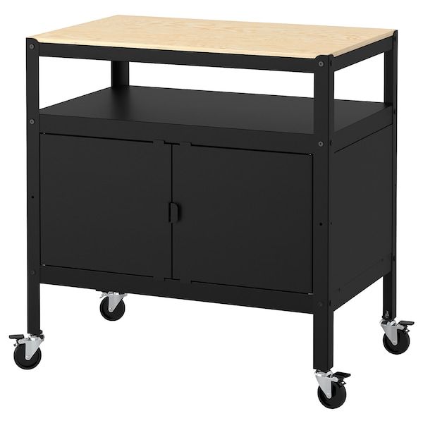 a black cabinet with wheels and a wooden top