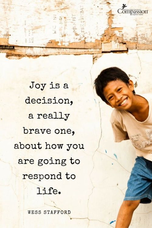 a young boy leaning against a wall with a quote on it that says, joy is a decision really brave one about how you are going to respond to life