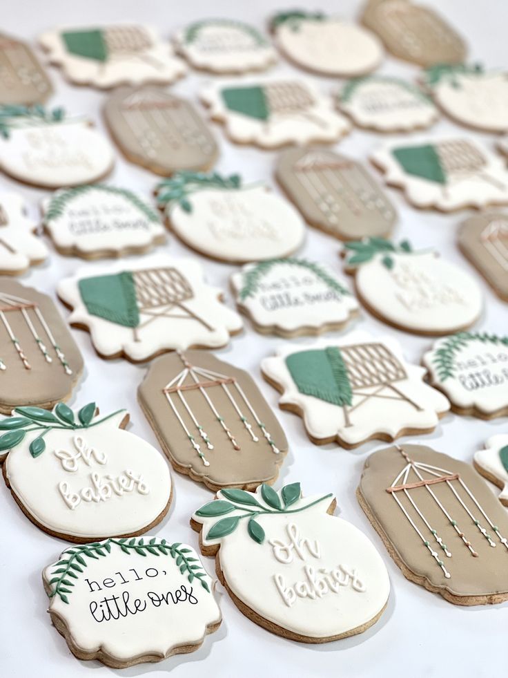 some cookies that are decorated with different designs and words on them, sitting on a table